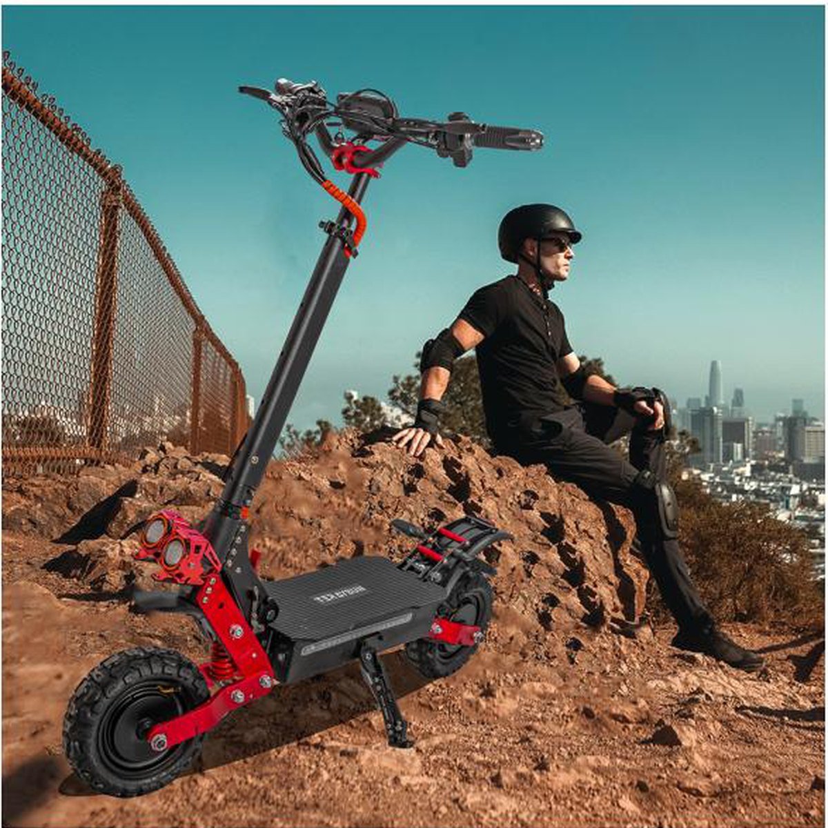 EXTREME 6000W dual-motor electric scooter on a dirt trail with its rider