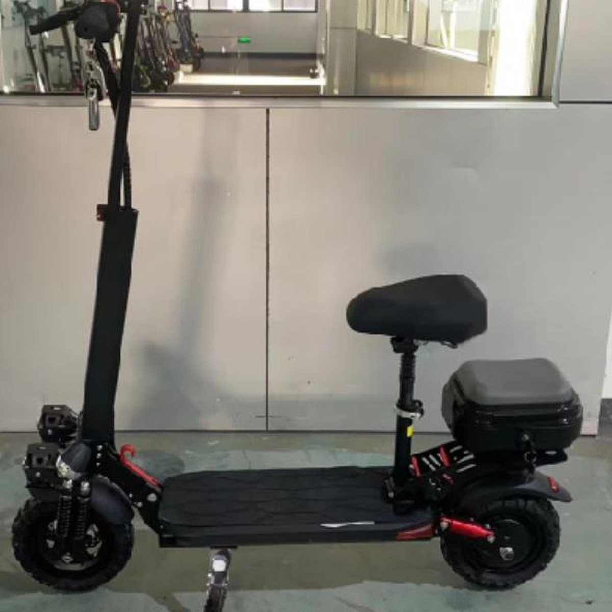 SPORT 1200W electric scooter fitted with the optional seat and rear box