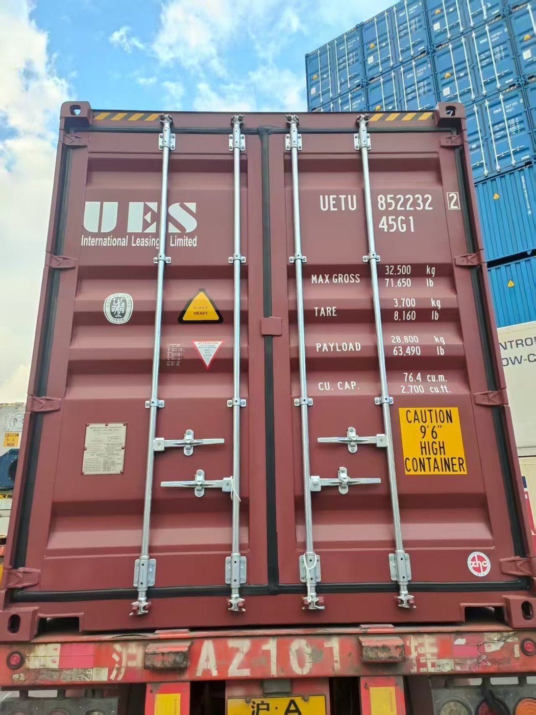 Sealed 45G1 high cube container UETU 852232 on a chassis at the terminal, container stacks behind